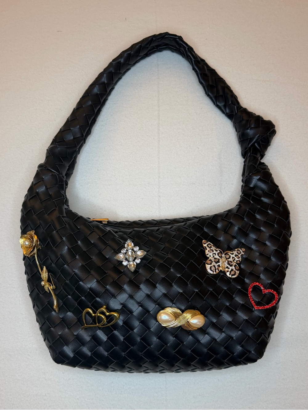 Black Woven Shoulder Bag with Decorative Brooches